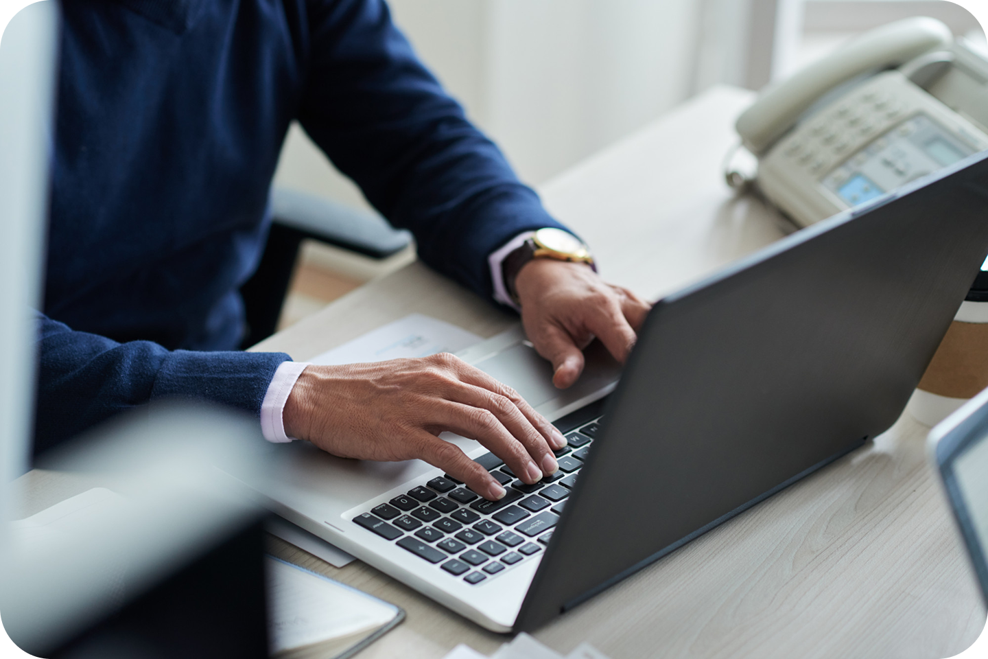 Developer working on laptop with no-code solutions